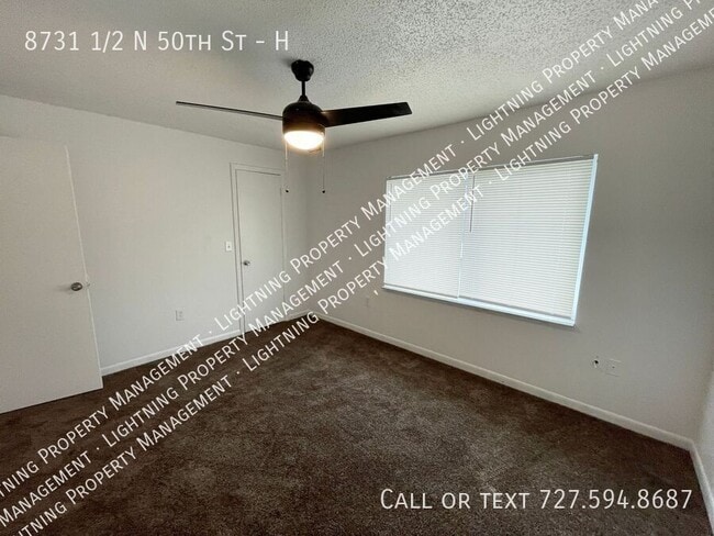 Building Photo - 8731 1/2 N 50th St-H