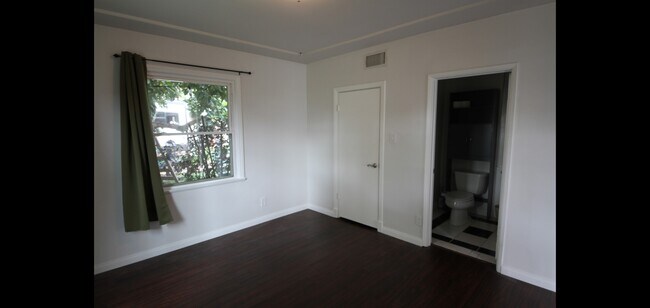 Southeast view into the bedroom where you can see the bathroom and the walk-in closet llllll - 14715 Addison St