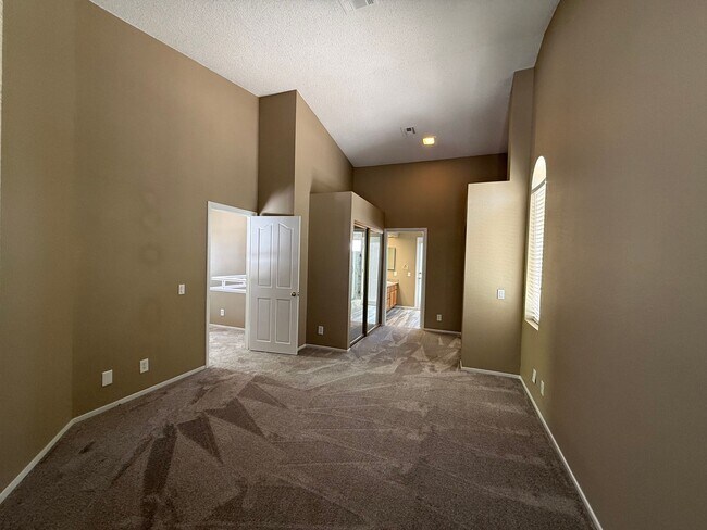 Building Photo - TWO BEDROOM TOWNHOME IN THE LAKES WITH GARAGE AND ATTACHED CARPORT