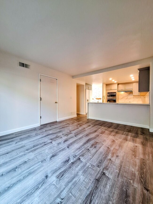 Building Photo - Spacious Two-Story 3bd Townhouse With Private Patios, Balcony, & Garage