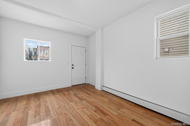 Building Photo - 25-61 99th St
