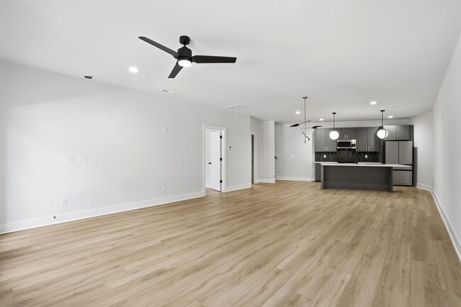 Building Photo - Bright, Open & Exceptionally Large—Your Ideal 2-Story Townhome
