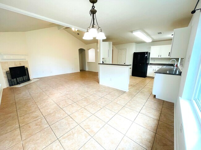 Spacious living, dining, and kitchen areas - 14511 Enola Dr