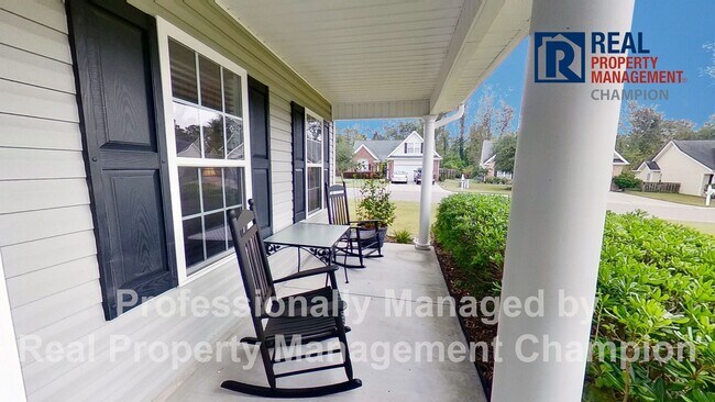 Primary Photo - Beautiful home boasts open floorplan, screened porch, and spacious fenced yard