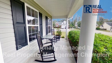 Building Photo - Beautiful home boasts open floorplan, screened porch, and spacious fenced yard