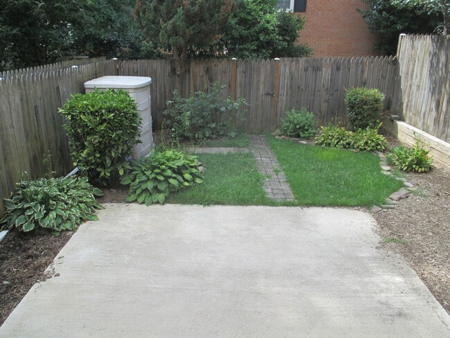Building Photo - SPACIOUS BRICK TOWN-HOME