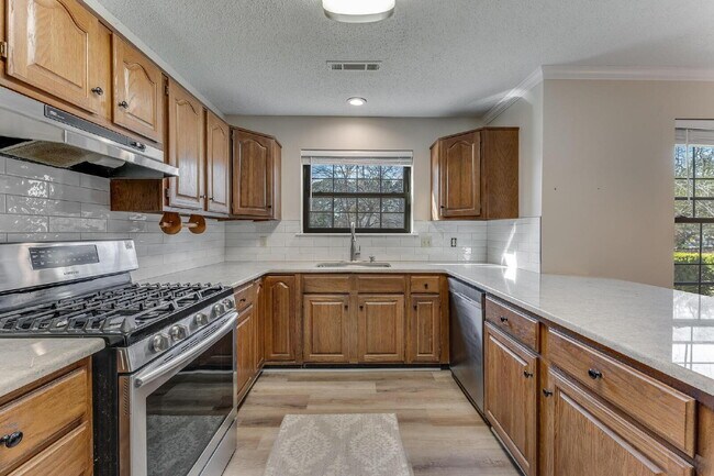 Building Photo - East Fayetteville 3-Bedroom Home with Granite Touches & Cozy Fireplace!"