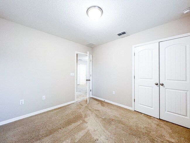 Building Photo - Spacious 4-Bedroom Townhome in Harmony – A Perfect Blend of Nature & Comfort!