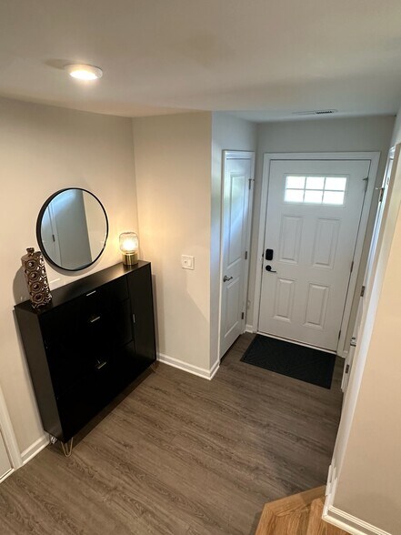 Coat closet on left and half bathroom on right - 4022 Edenborn Ln