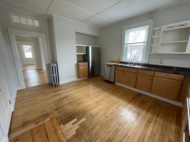 Kitchen w/ stainless steel appliances. - 18 North St