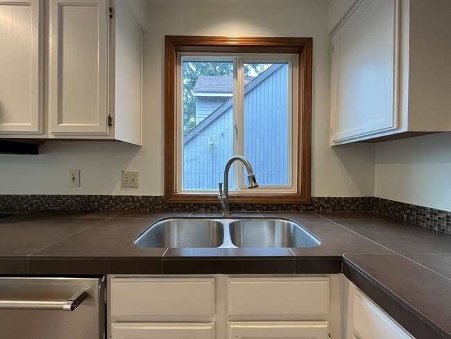 Building Photo - Spacious 3-Bedroom Home with Custom Stone Fireplace, Attached 2-Car Garage & Expansive Backyard i...