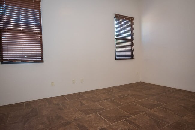 Building Photo - Gorgeous 3 Bedroom 2 Bathroom Home with Tile Throughout! Central A/C, 2 Car Garage!