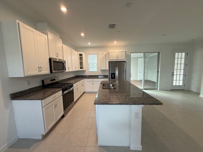 Building Photo - Brand new construction 3 Bedroom Town Home in Island Village of Celebration