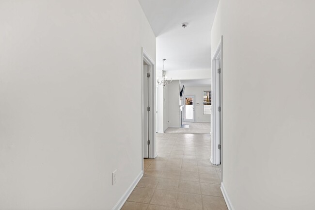 Building Photo - Spacious 4-Bedroom End-Unit Townhome in a ...