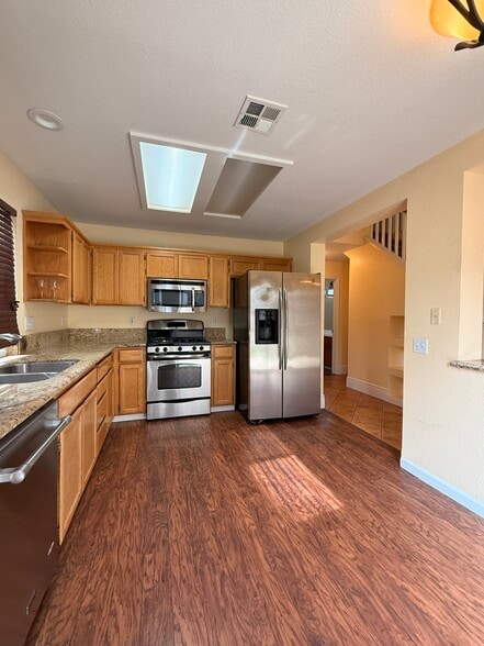 Kitchen with sliding patio door behind - 3326 Amberfield Cir