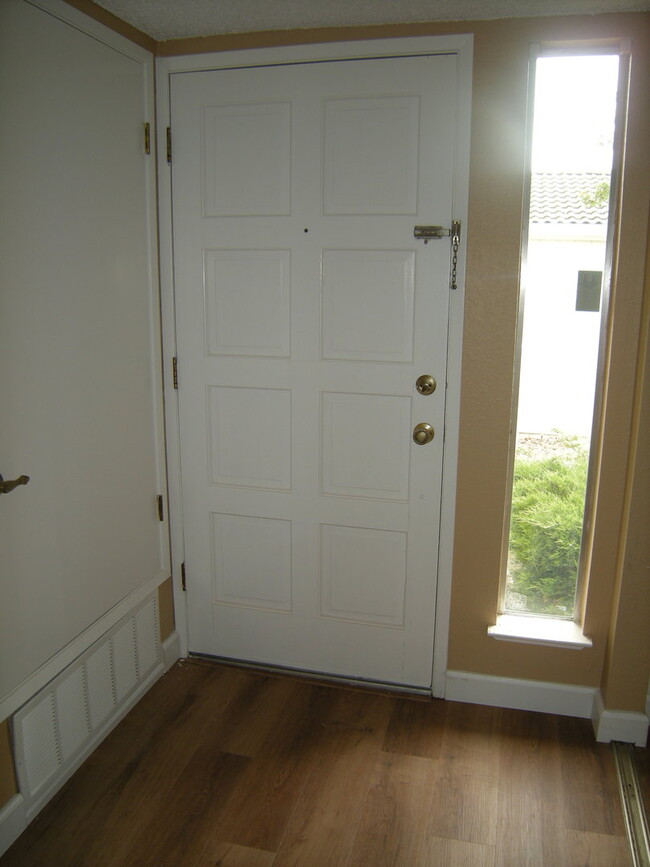 Building Photo - Condo unit featuring updated kitchen with ...