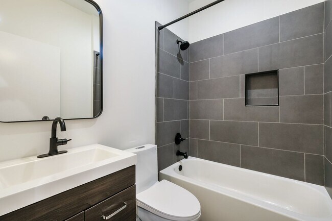 Building Photo - 50% OFF APPLICATION FEE! Sleek 2BR Townhome-Style Condo with Rooftop Deck