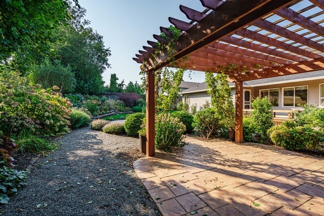 Building Photo - Beautifully Landscaped 1/4 acre with Well Maintained 4 bedroom 2 Bath Home with 3 Car Garage