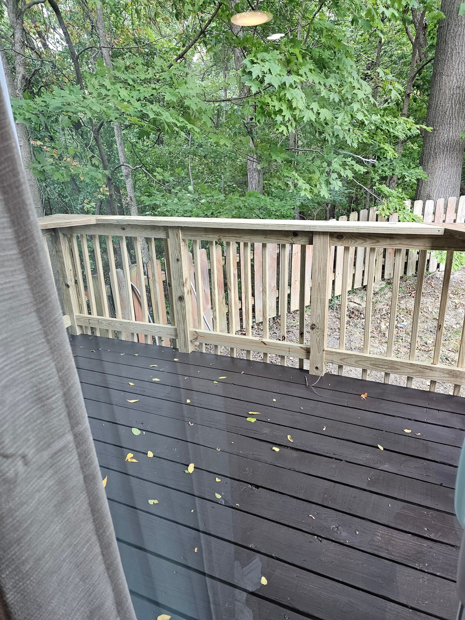 Back deck, staining in progress, backs up to ravine for privacy. - 2788 Blossom Ave
