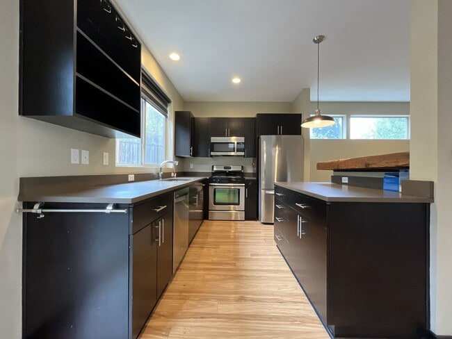 Building Photo - Charming 3 Bedroom, 2.5 Bathroom Home with Large Living Room, Tall Windows, Island Kitchen, and A...