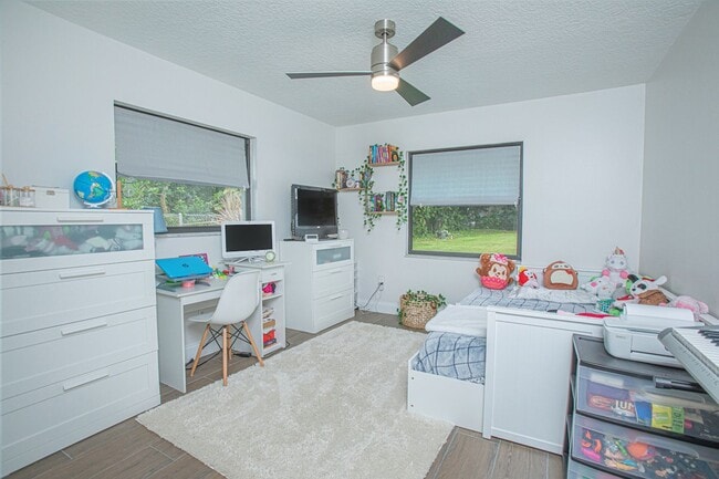 Building Photo - Beautifully Updated 3/2 Pool Home with Large Backyard in Lake Ajay (Gated Community)