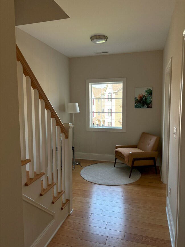 Main floor, landing area with access to half bath and additional bedroom with full bath attached. - 140 Wells View Rd