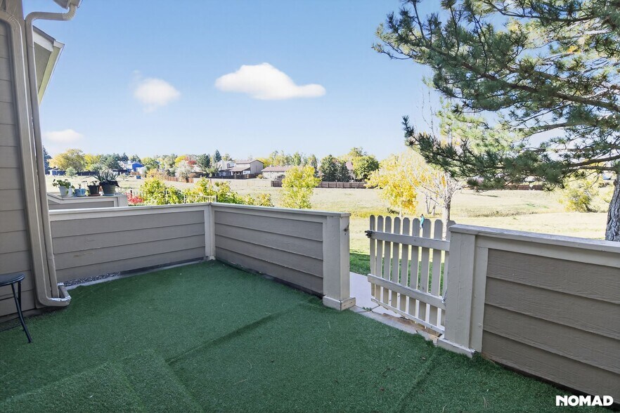 Beautiful front patio deck with a closed fence to enjoy your evenings - 1089 S Walden Way
