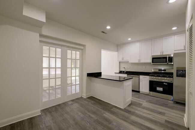 Building Photo - Charming & Renovated Petworth Rowhouse with Parking -  Available Now!