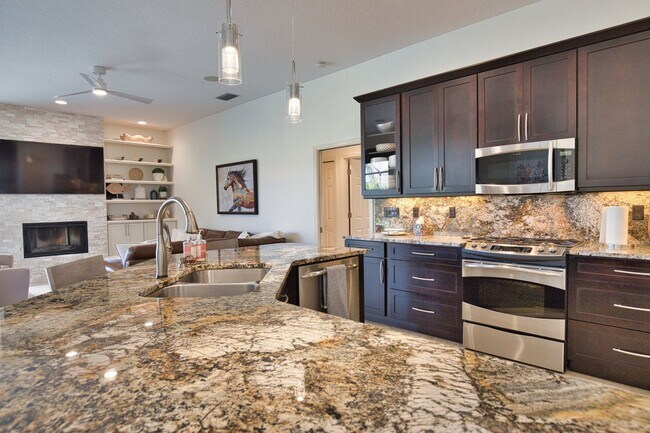 Building Photo - Luxury Home with Saltwater Heated Pool, Spa & Spectacular Golf Course Views, and includes Social ...