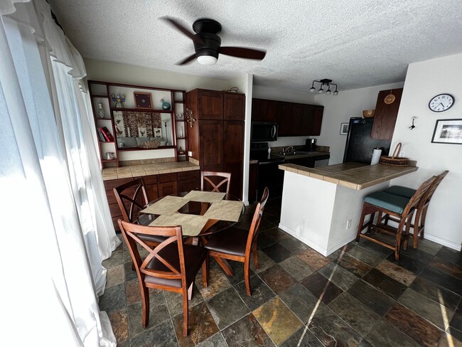 Building Photo - Furnished 2 bedroom 2 bath condo with assigned parking stalls