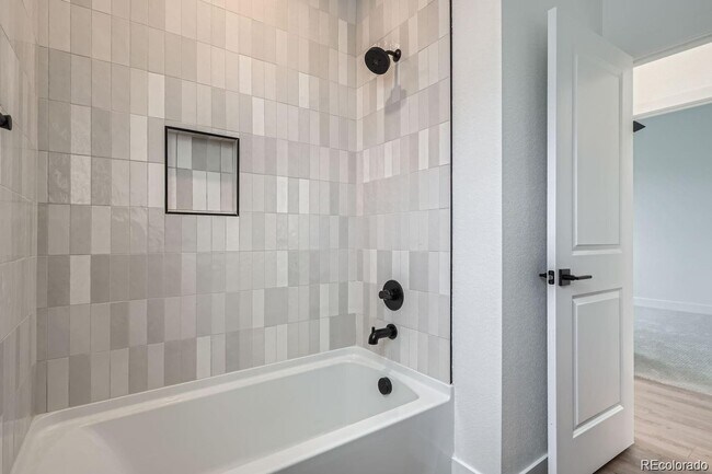 Building Photo - New Construction 3-Bedroom Townhome with Rooftop Deck & Mountain Views