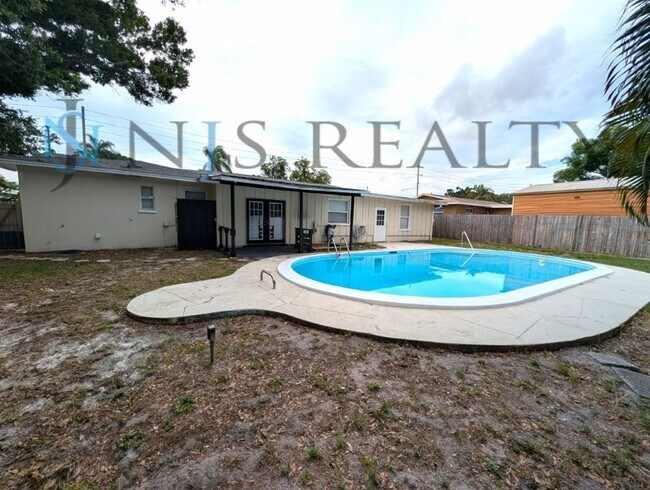 Building Photo - Beautiful 4/2/2 home with a POOL, 1700 Sq. Ft. with fenced yard, TONS of renovations