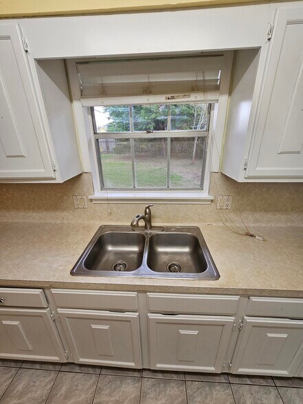 Kitchen Faucet looking Backyard - 618 Land O Lakes Dr