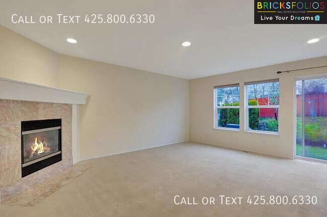 Building Photo - Dream Kitchen, Dual Fireplaces: Find Your Stylish Sanctuary in Redmond Ridge.