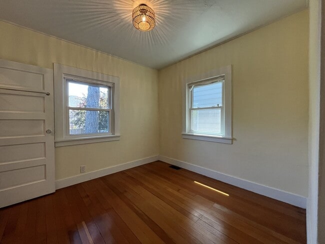 Building Photo - Charming Cottage with Hardwood Flooring, Modern Kitchen & Beautiful Outdoor Living Areas