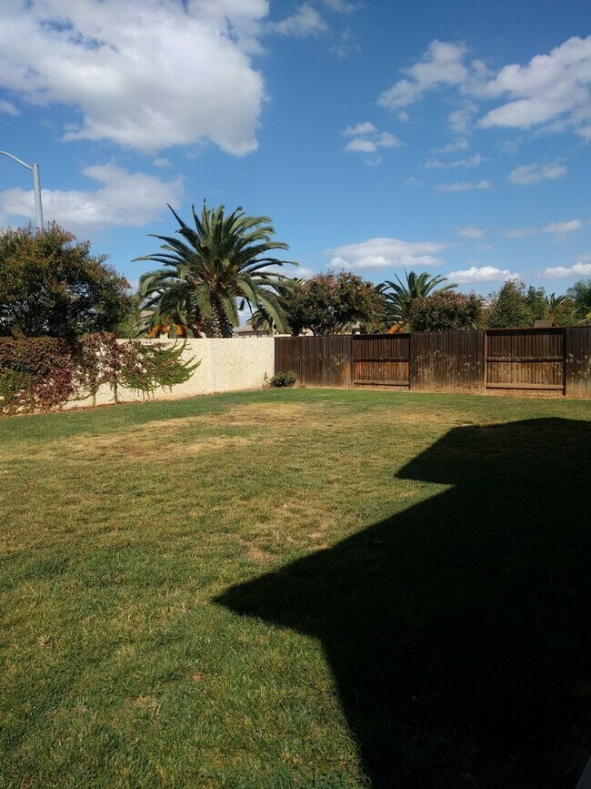 Building Photo - Gated Community Stunner ready to be called...