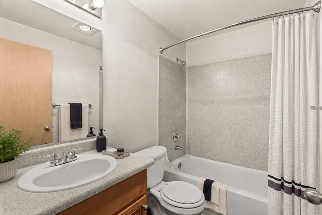 Staged bathroom with polished modern details. - Villas at Lawrence