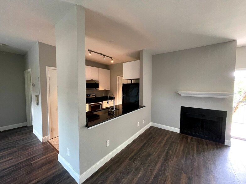 Kitchen opening to the living room - 12166 Metric Blvd