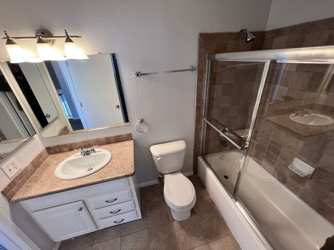 Building Photo - COMING SOON! 3-Bedroom Condo with Epoxy Garage in Vista Fairways, Valencia!