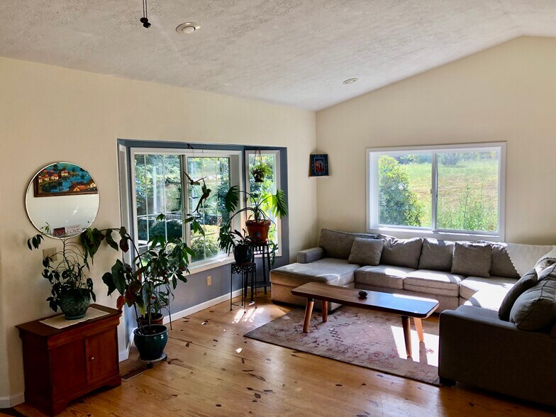We call this the couch room-its the main floor living room - 32724 NE Chamberlain Rd