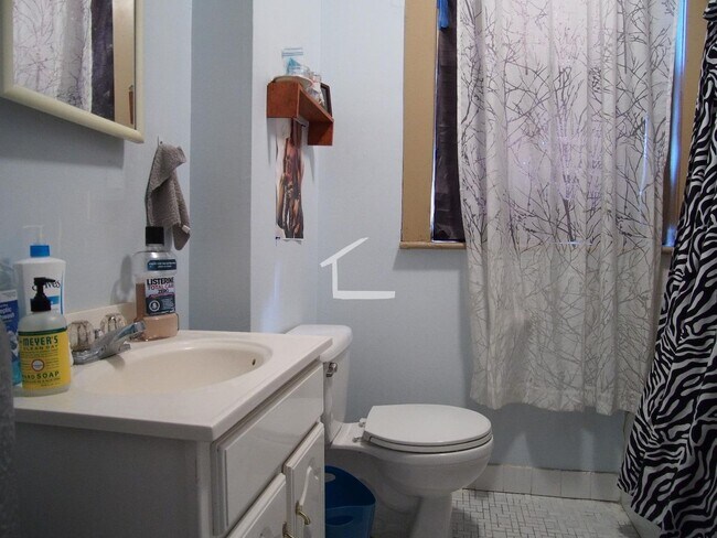 Building Photo - Great four bed, two bath, laundry in unit, heat included