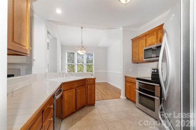 Building Photo - 4-Bedroom 2-Bath Home Nestled In The Popular Rock Barn Community!