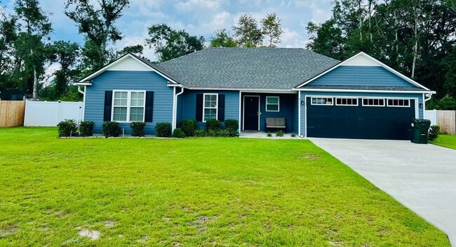 Primary Photo - Modern 4-Bedroom Home with Open Layout, Sp...