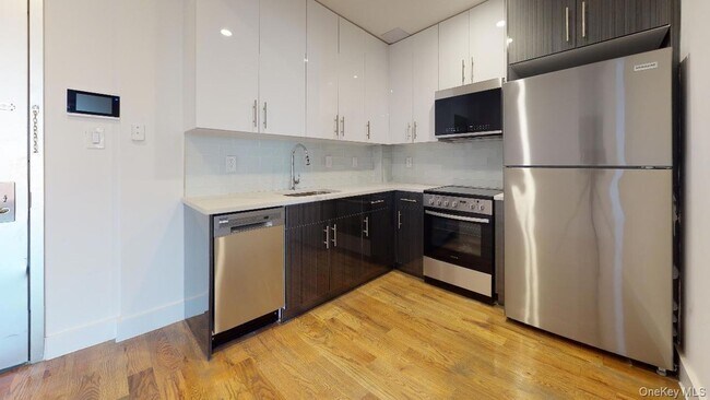 Building Photo - 138-28 Queens Blvd