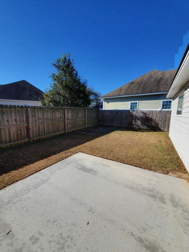 Building Photo - Spacious 4-Bedroom Home with Open Layout, Granite Finishes & Fenced Yard