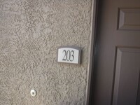 Building Photo - SECOND STORY CONDO IN GATED COMMUNITY WITH...