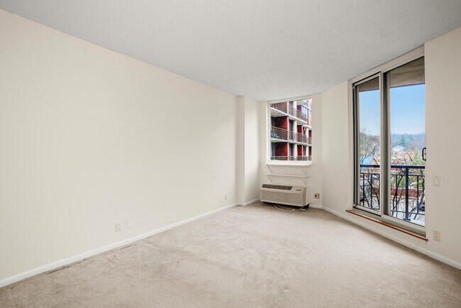 Main bedroom, door to balcony. - 50 E Hartsdale Ave