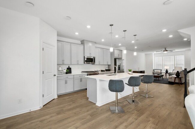 Kitchen with Large Island and Bar Seating - Greystone Suwanee