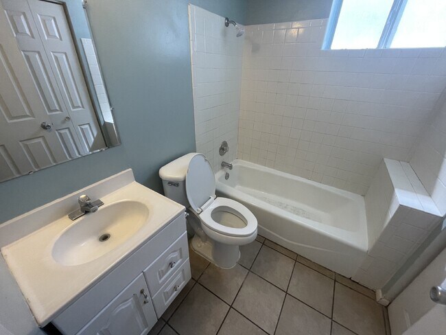 Building Photo - Spacious 6-Bed Oasis with Finished Basement & Cozy Fireplace.