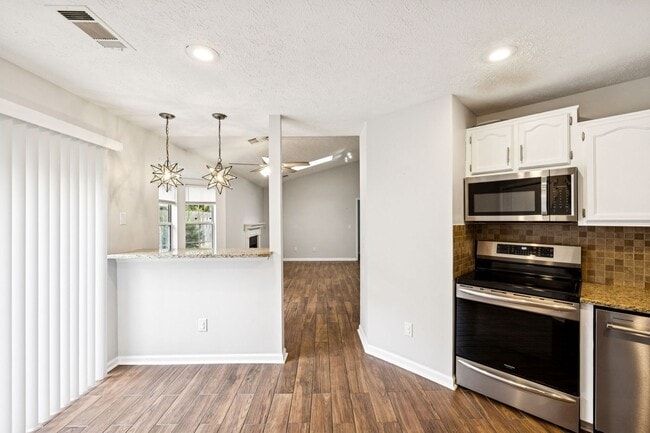Building Photo - Welcome to this beautifully remodeled sing...